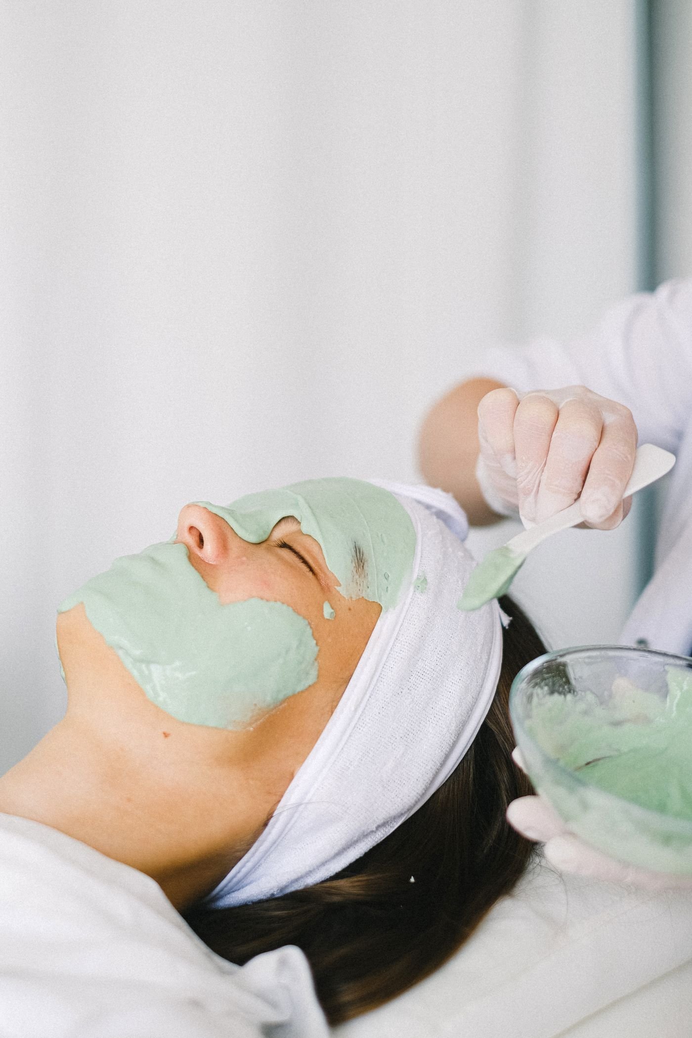 Stock photo of a client receiving a soothing facial mask