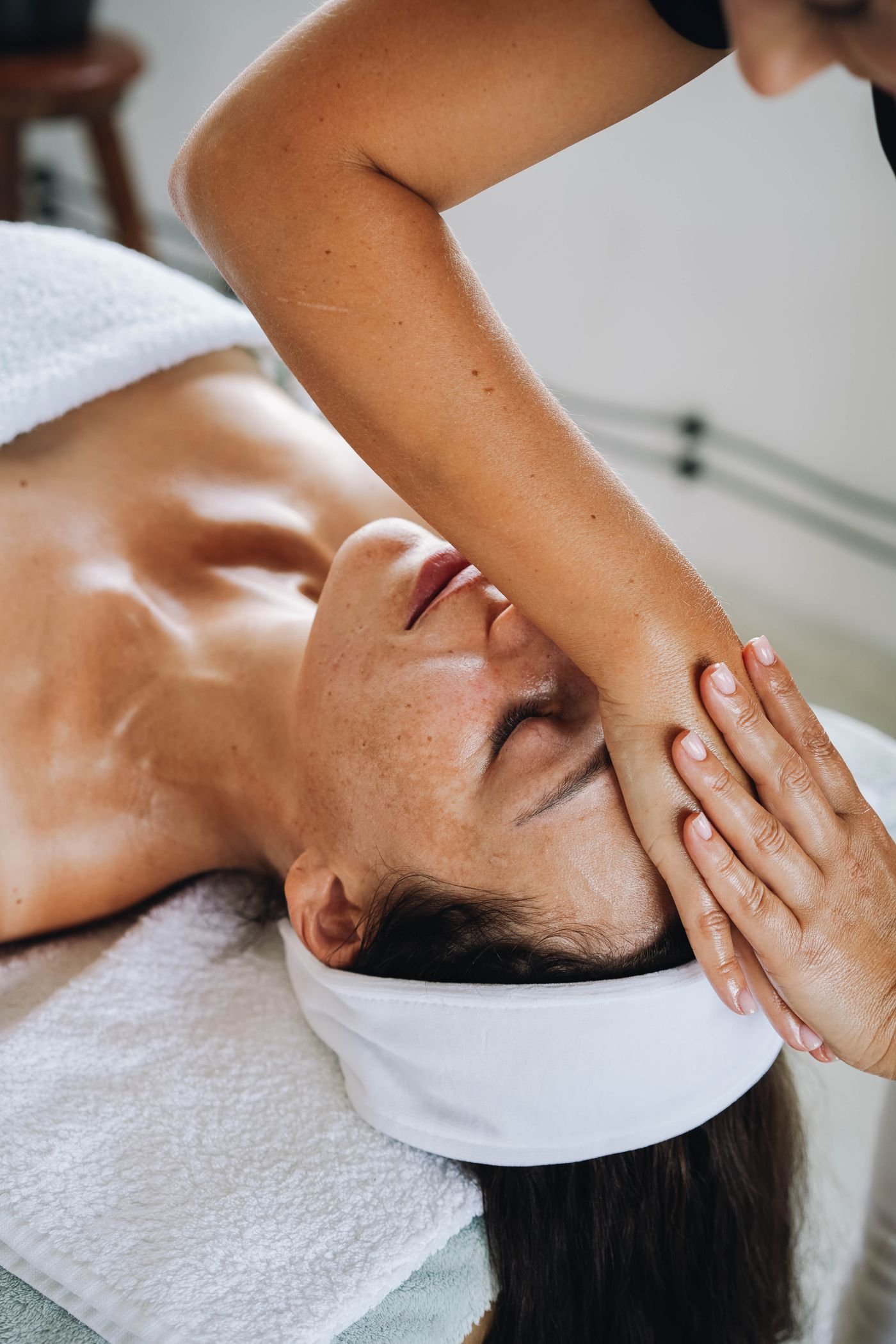 Stock photo of a client receiving a facial massage